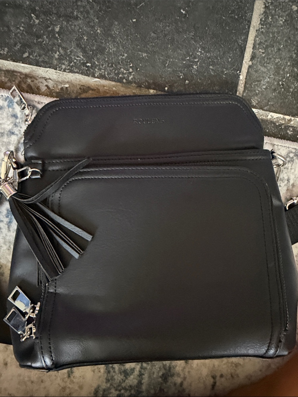 Minimalist Black Crossbody Bag with Tassel Accent